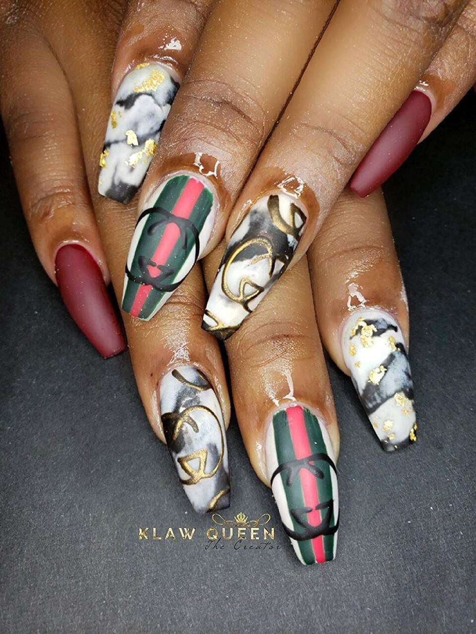 red nail polish on dark skin