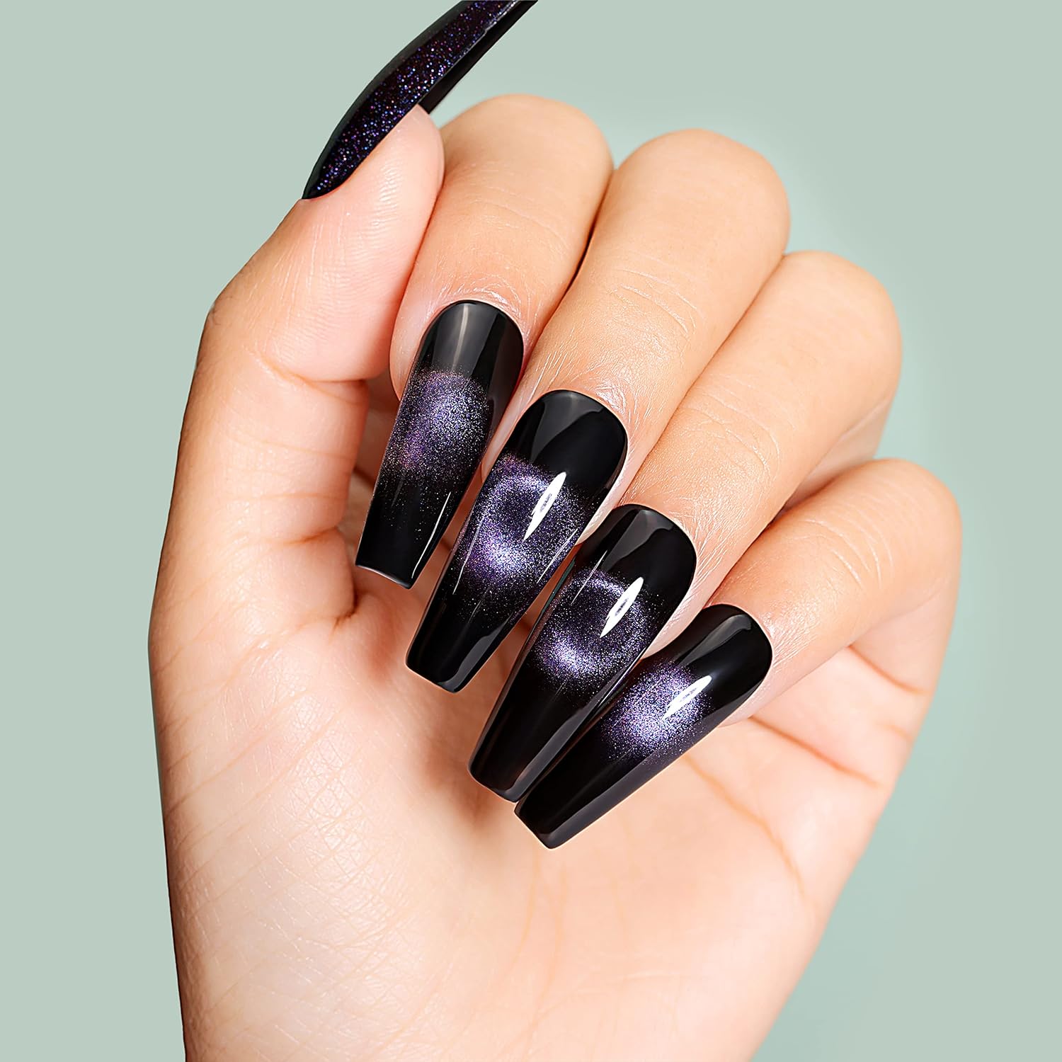 black and purple cat eye nails