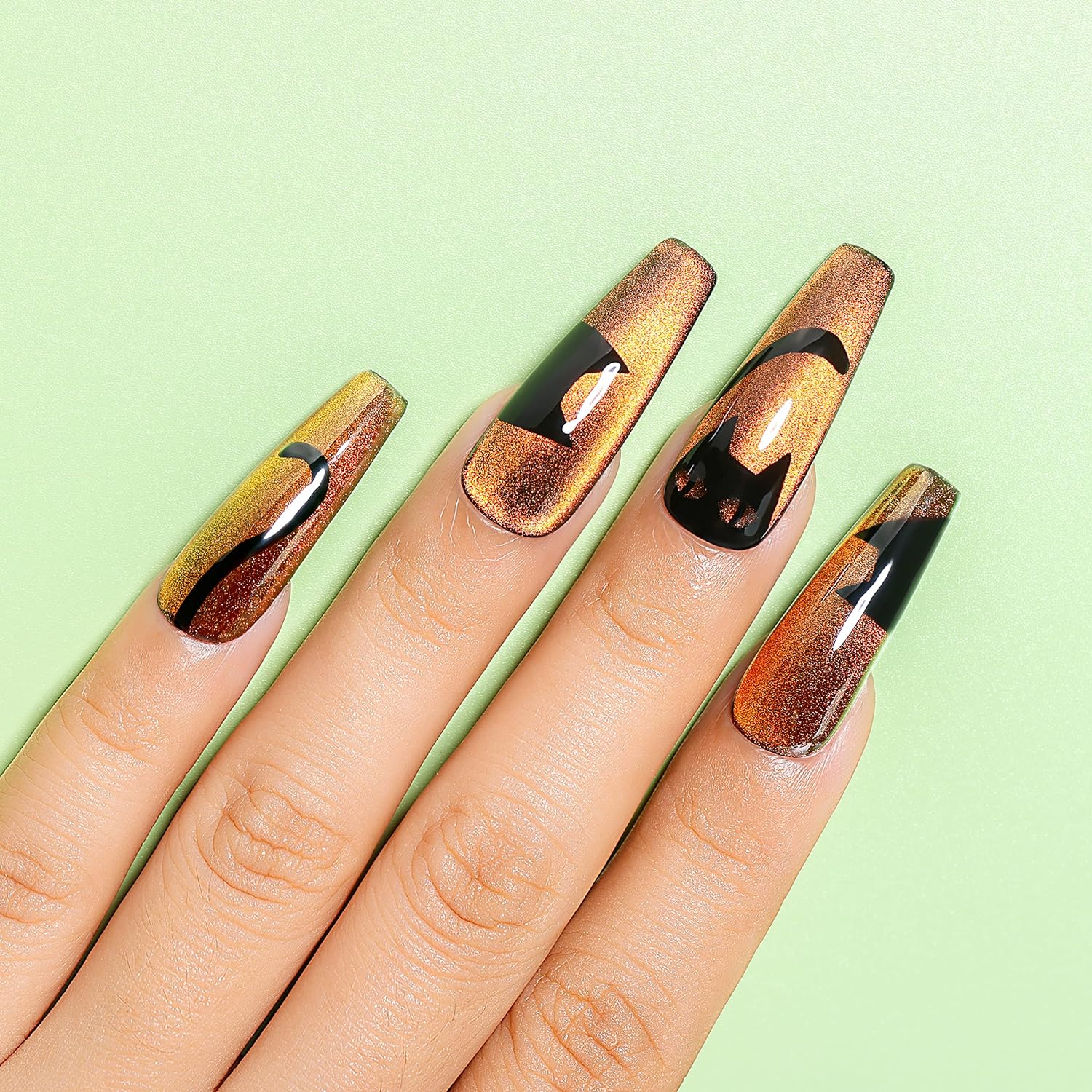 black and gold cat eye nails