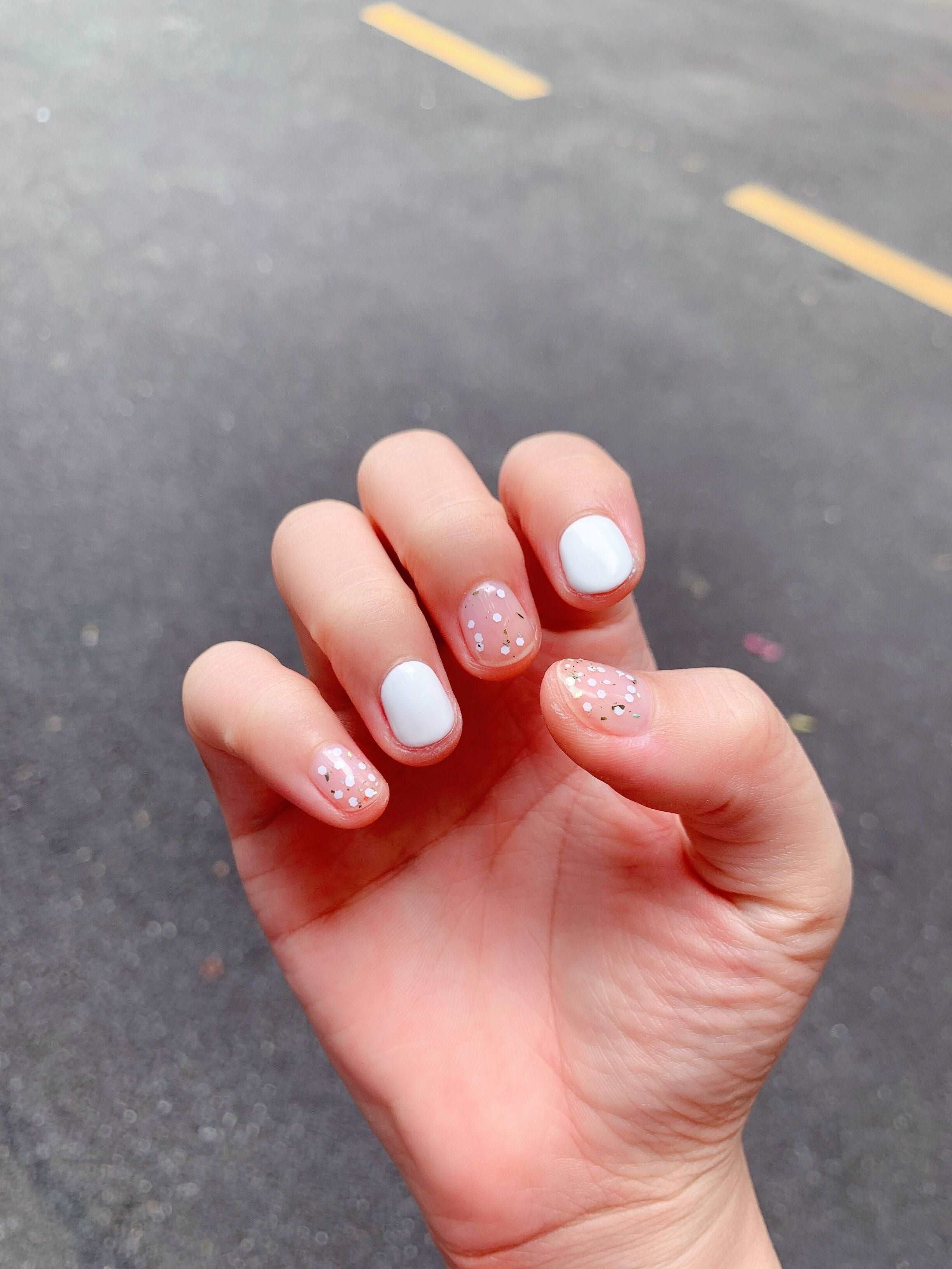 white and pink glitter nail