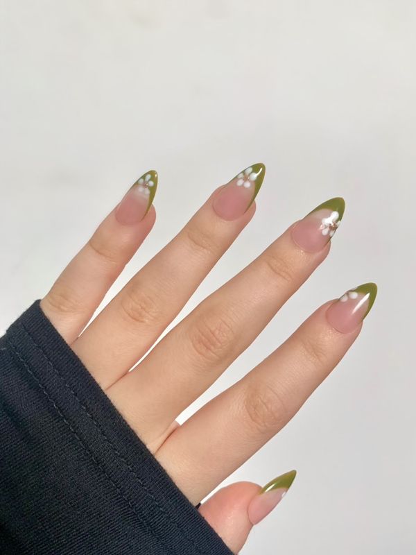 Green with white flower nail design